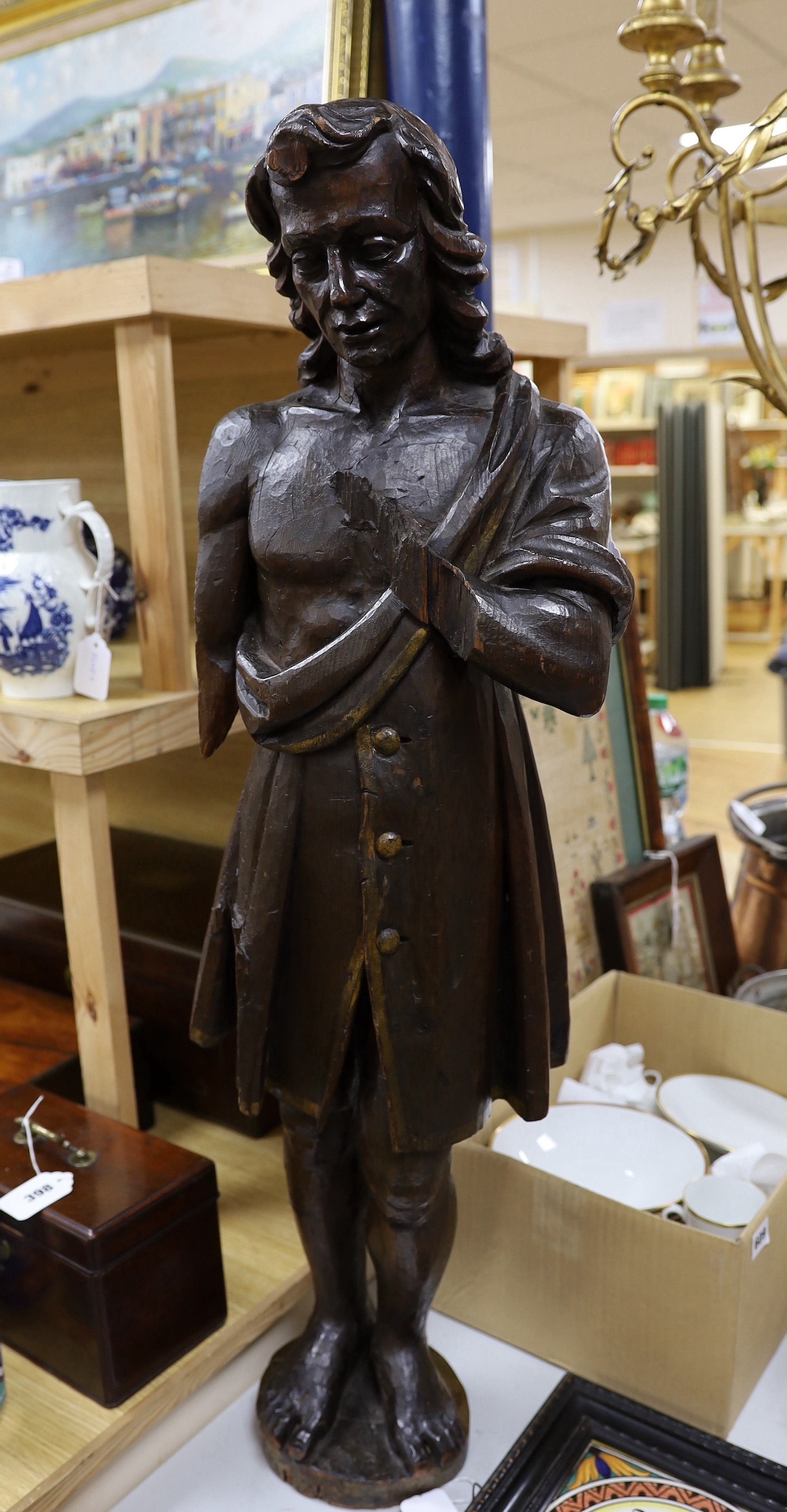 An early 18th century French figurative carving, 84cm high